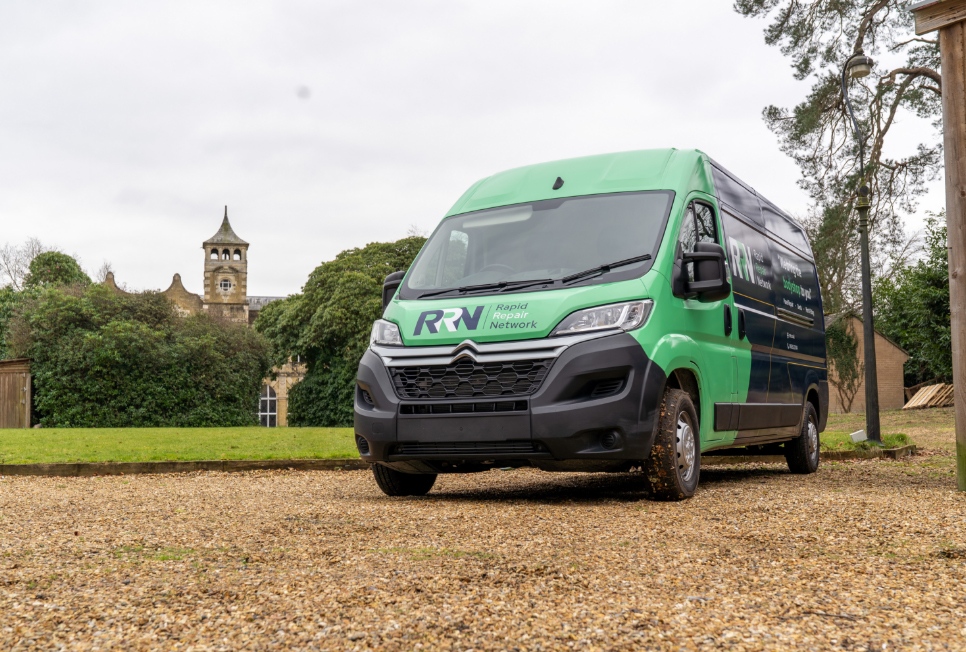 Rapid Repair Network branded van parked in driveway