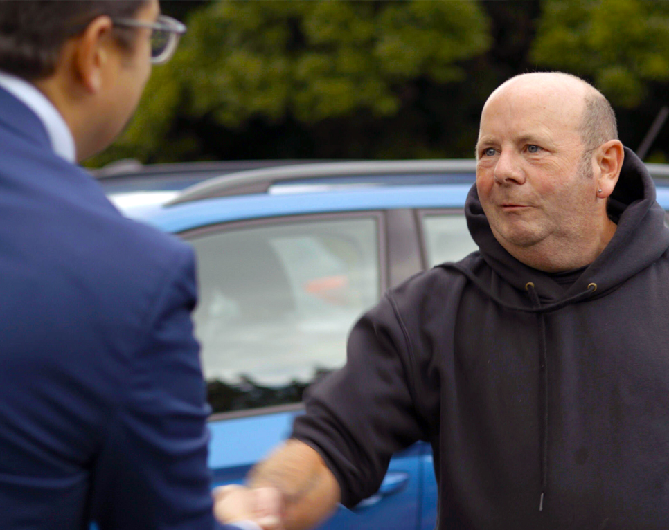 State-of-the-Art Repairs at Your Doorstep Technician shaking hands with customer whilst smiling
