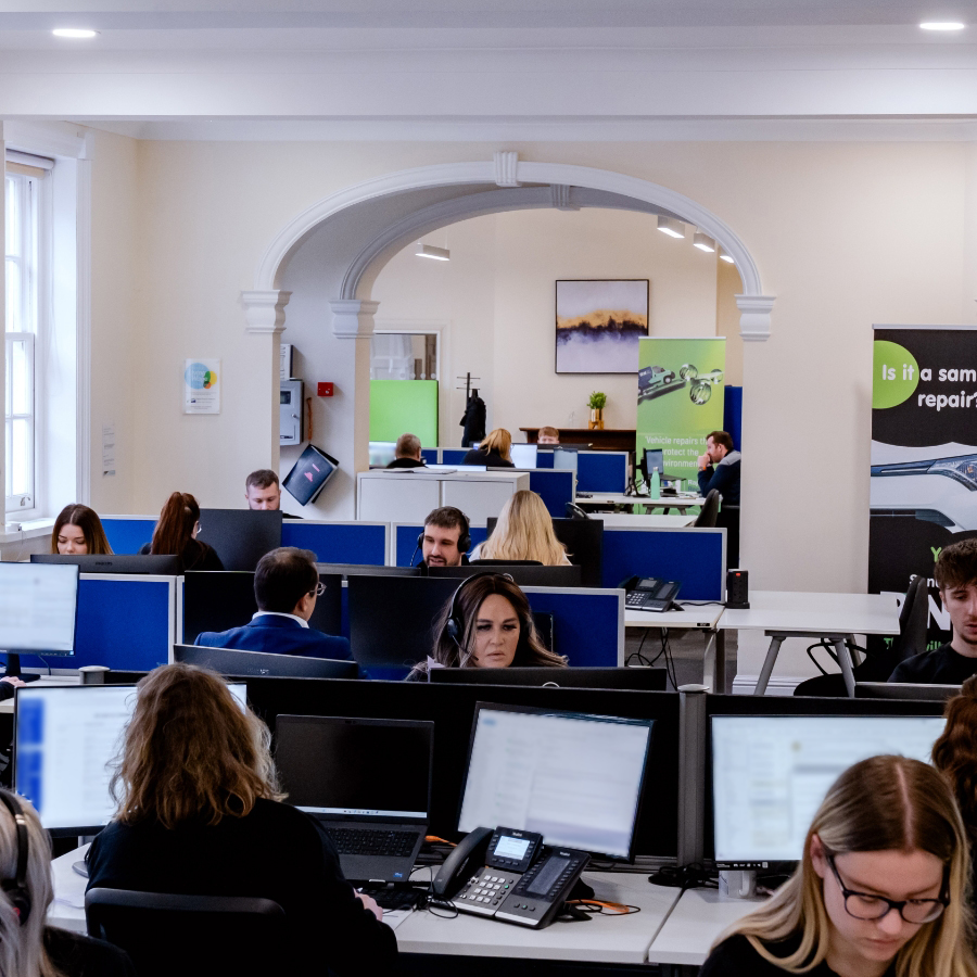 Image of support team at their computers