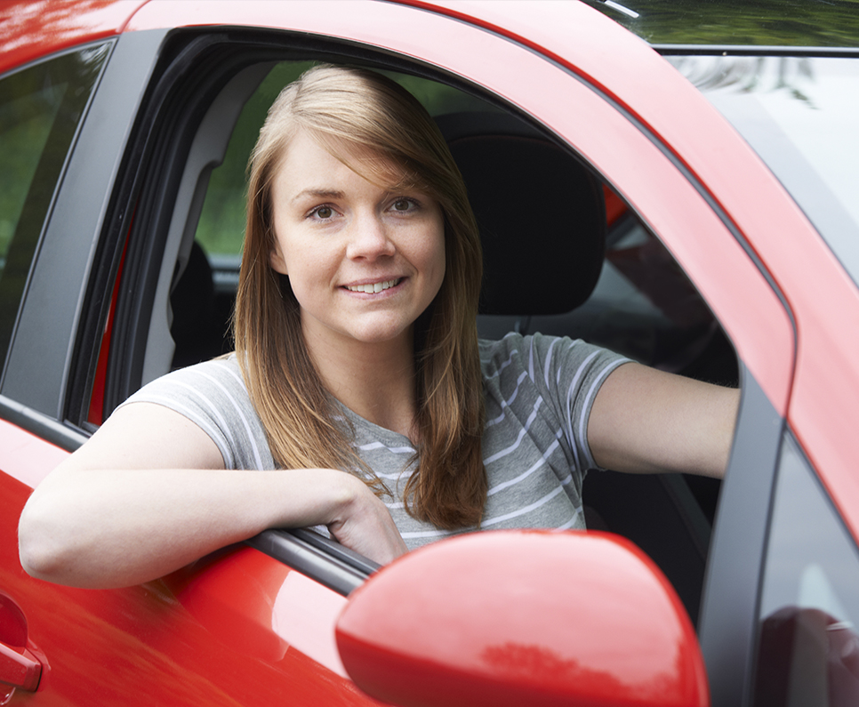 Supporting Your Policyholders Woman smiling out car window
